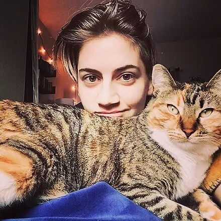 Photo of Rose Sinclair with tabby cat